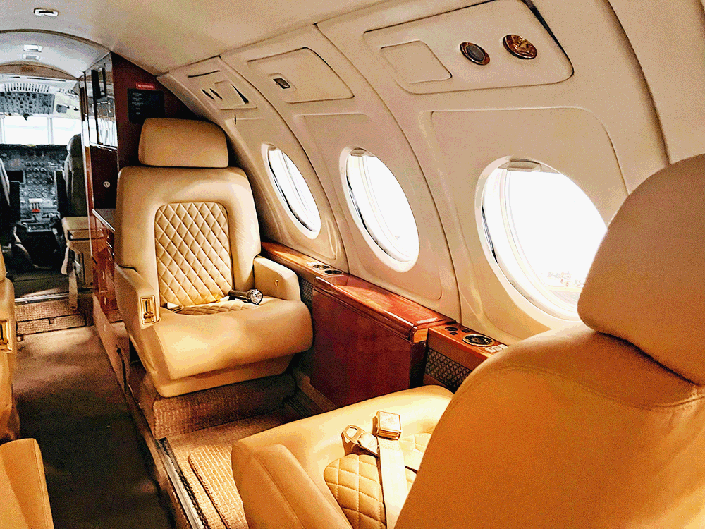 private jet cabin interior photo by Yaroslav Muzychenko